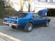 1969 Ford Mustang - 1969 Ford Mustang fastback with a spoiler and racing stripes.