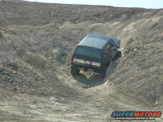 1996 Ford Bronco climbing a steep, rocky incline