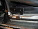 1996 Ford Bronco - Close-up view of a radiator fan shroud with hoses connected.