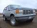 1988 Ford Bronco - 1988 Ford Bronco stuck in mud, showing front 3/4 view with license plate PPC 121.