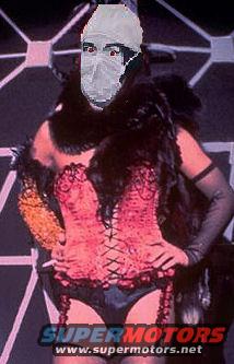 Person wearing a mask and costume with 'SUPER MOTORS' logo visible