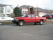 1996 Dodge 2500 - This red 1996 Dodge 2500 pickup truck is parked on a residential street.