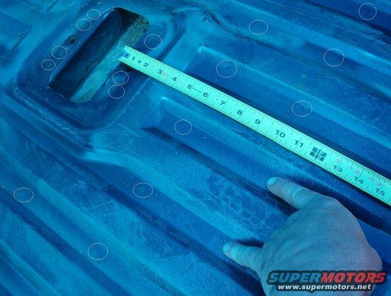 02welds.jpg Locate the line of spot welds holding the bed down on the body mount channel.  The lip of the channel extends about 1/2&quot; rearward of these welds.  The front edge of the hole can be an inch or so behind the welds to avoid the lip of the floor support channel. You can always cut the hole too small, and then enlarge it as-needed. But if you cut it too large, the plate won't cover the hole, so always start small.