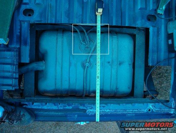 08size.jpg This is where the hole should be.  DO NOT CUT everything out like this pic shows - I'm harvesting the floor from this body to make cover plates.  Trace around your replacement plate, and cut INSIDE it so you have room to screw it down, which should be approximately the size of the white rectangle.  The front edge of the hole can be an inch or so behind the welds to avoid the lip of the floor support channel. You can always cut the hole too small, and then enlarge it as-needed. But if you cut it too large, the plate won't cover the hole, so always start small. To maintain floor strength, the plate should overhang the rear of the hole, and the screws should be positioned close to the hole and as far as possible from the plate's rear edge. So cut the rear edge of the hole as far forward as possible to give access to the tank.

If you're unsure, cut LESS out than is necessary.  Once you can see the target, cut more in the direction you want until you have the smallest hole positioned just where you need it to disconnect the lines & pull the pump assembly out.  Never cut more than 3 ridges wide, or longer than 3/4&quot; SHORTER (front-to-back) than the cover plate.

Along the front edge, the screw tips MAY contact the beam's lip under the floor.  To avoid that, position the plate slightly rearward when marking the cut lines so there's enough good floor between the beam lip & the hole for the screws to catch.