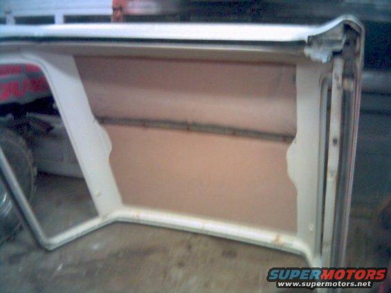Interior of a white removable soft top with tan lining
