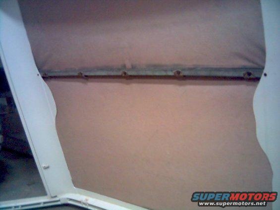 1986 Ford Bronco interior showing the soft top mounting hardware and fabric