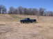 1995 GMC Sierra 1500 - A 1995 GMC Sierra 1500 pickup truck sits in a dry, grassy field under a clear blue sky.