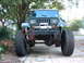 1994 Jeep YJ - This Jeep Wrangler features oversized tires and a front-mounted winch, suggesting off-road modifications.