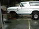 1978 Ford Bronco - 1978 Ford Bronco undergoing front suspension work, jacked up with parts laid out.