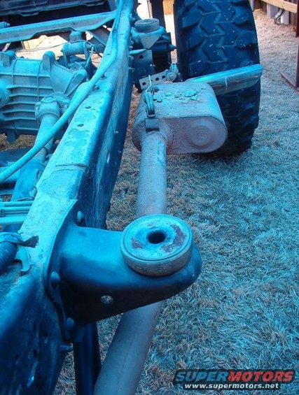 Muffler placement is the reason there's no e-brake.  Also, it should have been hung off the frame instead of the body.
