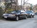 1992 Ford Crown Victoria - A 1992 Ford Crown Victoria is parked on a street, with a blue and white SUV behind it.