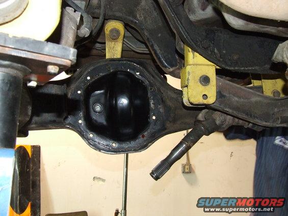 close-up of rear differential assembly with yellow suspension components