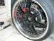 1996 Ford Probe - Custom wheel and tire assembly with red brake caliper visible.
