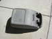 1987 Ford Bronco - This is a vehicle's center console, a flip-top storage area and dual cup holders.