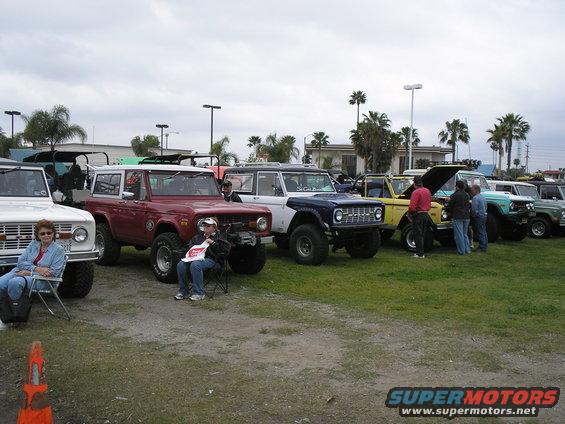Line of 1966 Ford Broncos, red and white models prominent