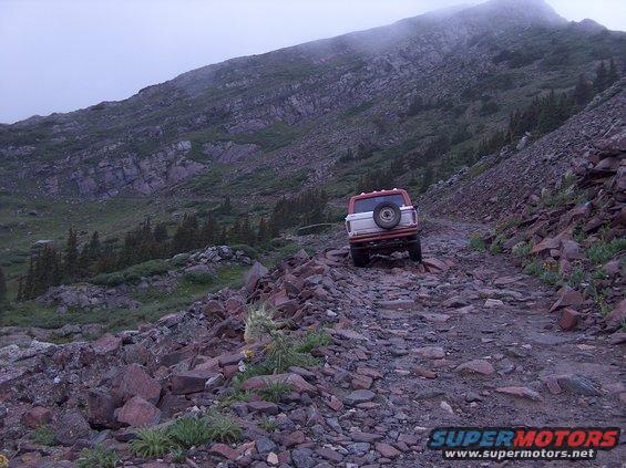 1978 Ford Bronco rear view on a rocky mountain trail