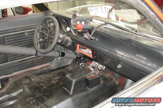 1981 Ford Mustang interior with racing gauges and shifter