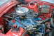 1981 Ford Mustang - The engine bay of a vehicle, showing the engine components and associated wiring and hoses.