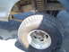 1979 Ford Bronco - This image focuses on the undercarriage of a vehicle, highlighting the tire and suspension system.