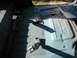 1981 Ford Bronco - The bare metal floor of a vehicle interior, showing seatbelt mounting points and some surface rust.