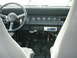 1995 Jeep Wrangler - Interior view of a Jeep, showing the dashboard, steering wheel, and center console with gear shifters.