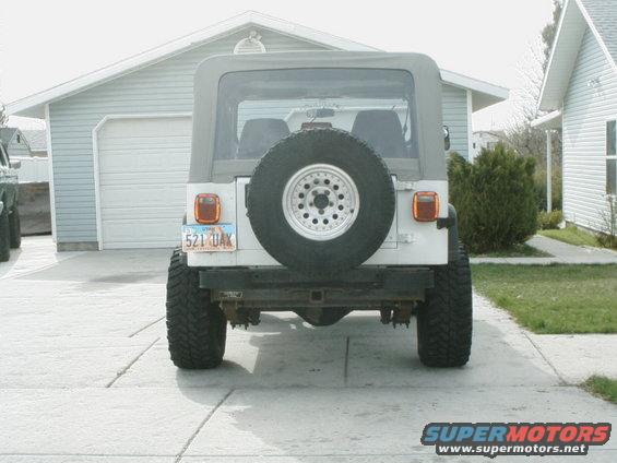 1995 Jeep Wrangler rear view, white, with spare tire