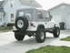 1995 Jeep Wrangler - This Jeep Wrangler is parked in a driveway with a house and garage visible.