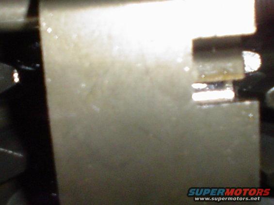 Close-up of a metallic component with a rectangular slot