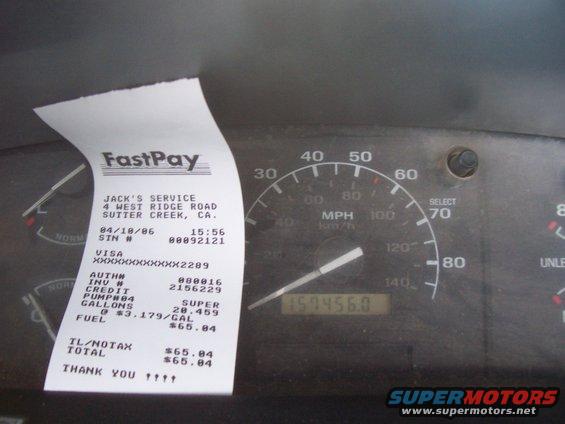 Interior dashboard with speedometer and gas receipt dated 04/18/86
