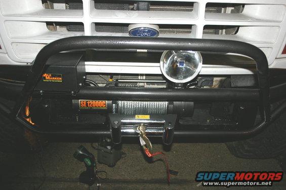 1995 Ford Bronco front bumper with Mile Marker winch and a large driving light