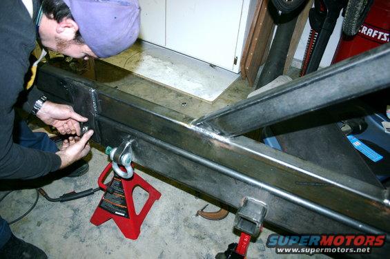 Custom rear bumper fabrication with tow hitch receiver and shackle mounts