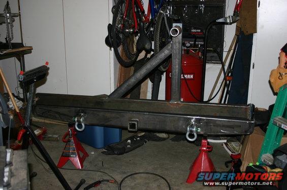 Custom rear bumper with tire carrier mount and tow hitch receiver