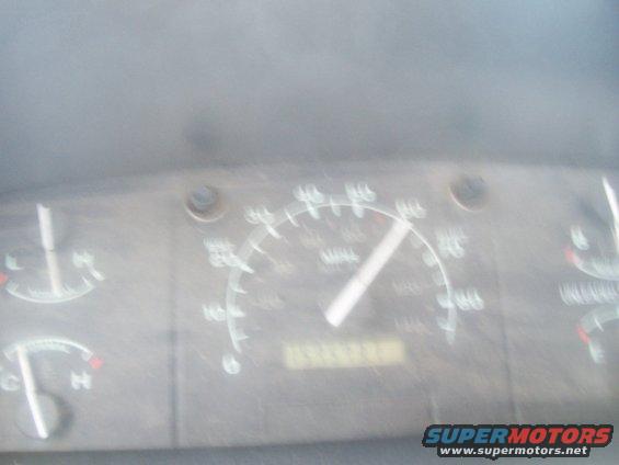 Dashboard with speedometer, fuel gauge, and odometer visible