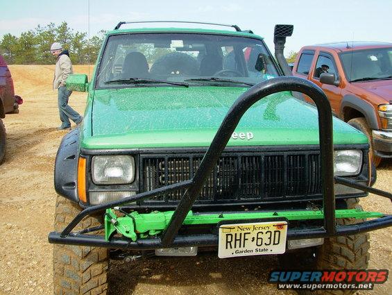Green Jeep Cherokee front view with snorkel and bull bar, New Jersey license plate RHF-63D