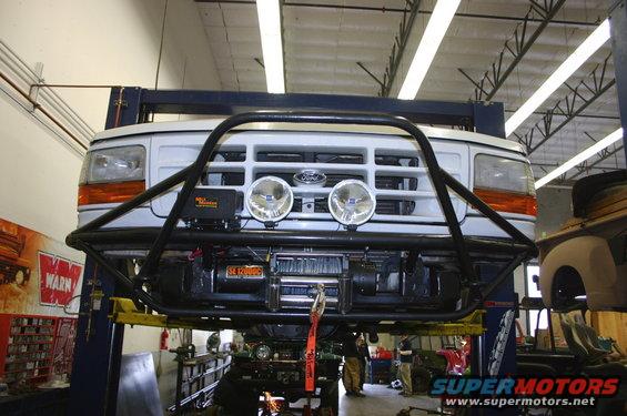 White 1995 Ford Bronco front with brush guard and winch