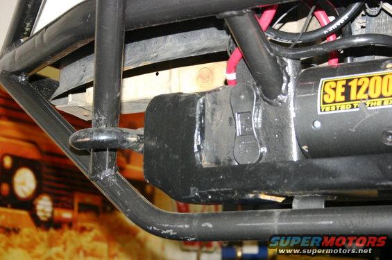 Winch mounted to custom roll cage, part of an off-road vehicle build