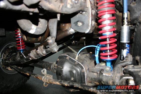 Front suspension with red Fox coilovers and differential