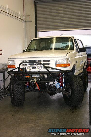 White 1995 Ford Bronco with custom bumper and winch