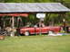 1966 Ford Ranchero - Red 1966 Ford Ranchero sits under a carport with its hood open, a basketball hoop mounted nearby.