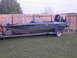 1982 Hydra-Sports Hydra-Sports prior to 2002 - A boat with 'X-270' and 'Hydro Sports' decals is on a trailer in front of a fence.