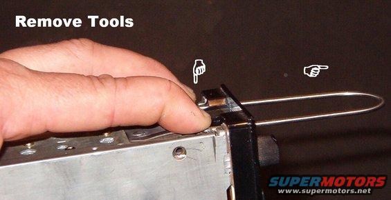 08unlock.jpg Once the radio is out, manually push the locks in to allow the tools to be extracted.