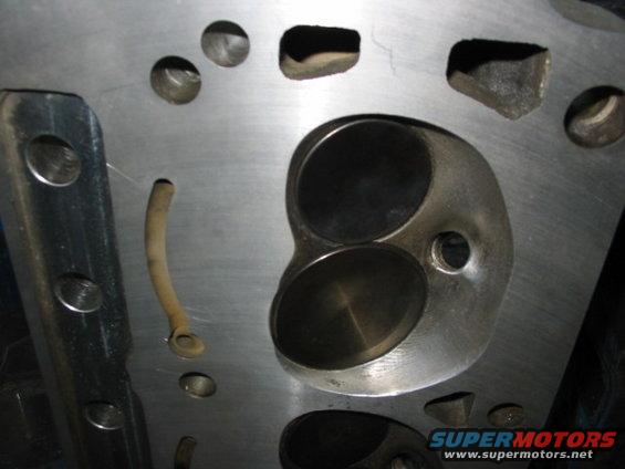 Engine cylinder head with two valve openings