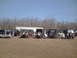 1991 Ford Bronco - A group of Jeep Wranglers are gathered in an outdoor lot under a clear blue sky.