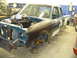 1997 Ford Ranger - A 1997 Ford Ranger truck is shown in a workshop with its engine compartment open and parts removed.