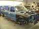 1997 Ford Ranger - This 1997 Ford Ranger is in a workshop, with its engine compartment open and parts removed.