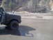 1991 Ford Bronco - This vehicle appears to be stuck in a muddy puddle during an off-road excursion.