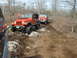 1991 Ford Bronco - Two Jeep Wranglers navigate a challenging rocky off-road trail through a wooded area.