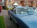 1970 Ford Ranchero - A blue 1970 Ford Ranchero is parked in a driveway with houses in the background.