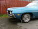 1970 Ford Ranchero - Front view of a blue 1970 Ford Ranchero 500 showing the fender, wheel, and grille detail.