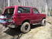 1994 Ford Bronco - This 1994 Ford Bronco is equipped for off-road adventures with its lifted suspension, aggressive tires, and rear-mounted high-lift jack.